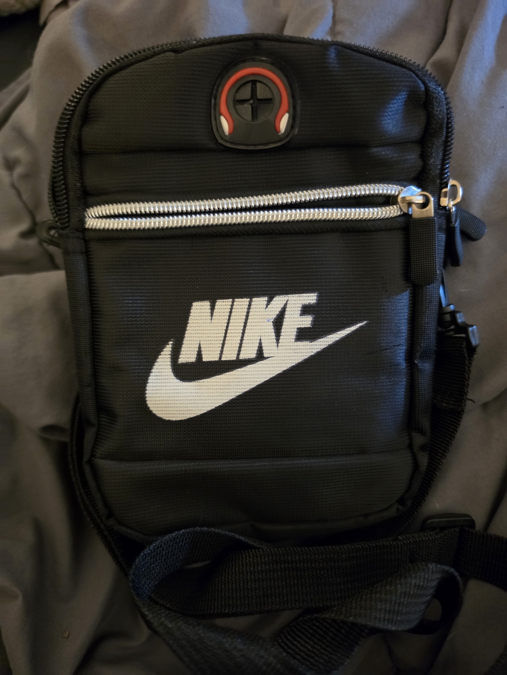 Nike Black Crossbody Bag with White Swoosh and Red Accent